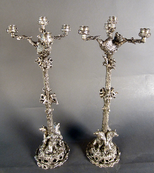 Pair of ornate Christophe Fratin (French, 1801-1864) silver-over-bronze candelabra, 23in tall, stamped ‘Fratin,’ decorated with sculpted silver monkeys and bears. Est. $10,000-$12,000. Sterling Associates image.
